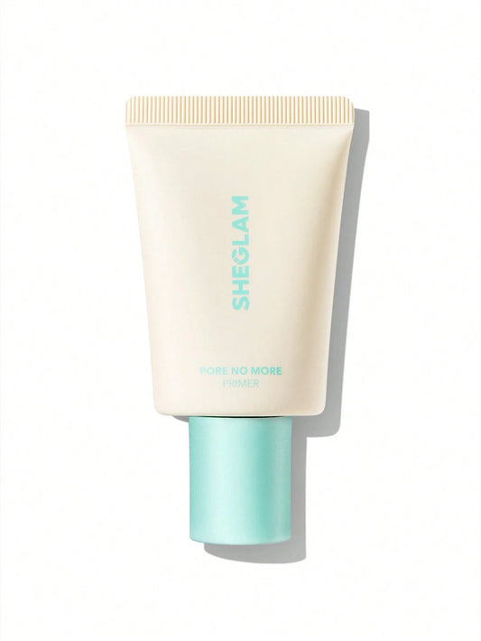 A tube of SHEGLAM Pore No More Primer with a beige body and green text, designed for achieving a flawless, shine-free look by minimizing pores and controlling oil.